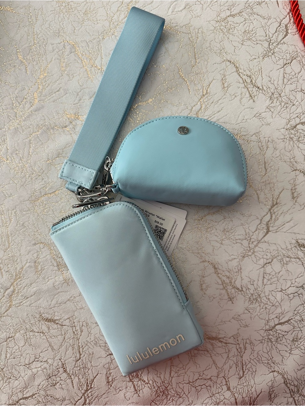 Lululemon Dual Pouch Wristlet wallet in light blue. 
NWT